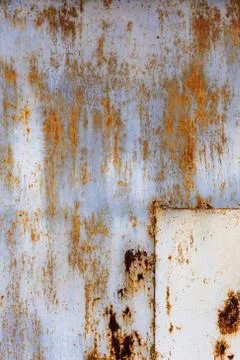 Rusted flat solid sheet metal surface with leftovers of white and light blue Stock Photos