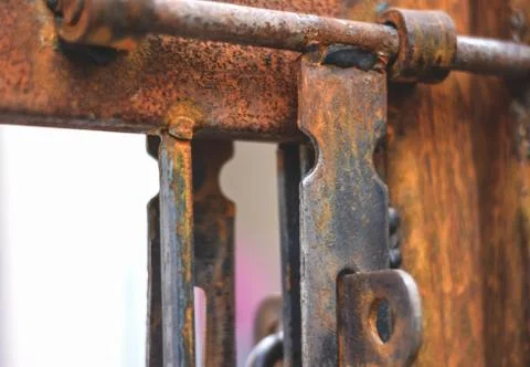 A rusted Gate with a handle lock Stock Photos