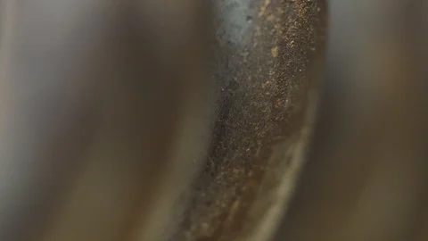 Rusted metal spring macro light sweep Stock Footage 119080236