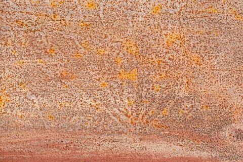 Rusted metal surface texture Fine orange rust spots cover a weathered steel.. Stock Photos