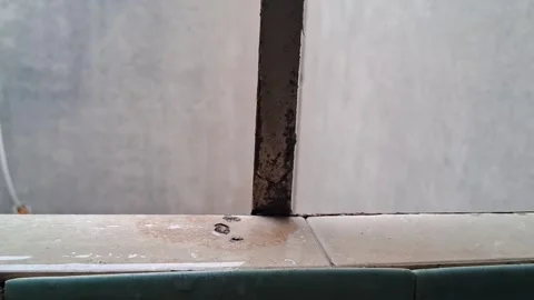 Rusted metal window frame showing decaying texture in motion video Stock Footage 339505658
