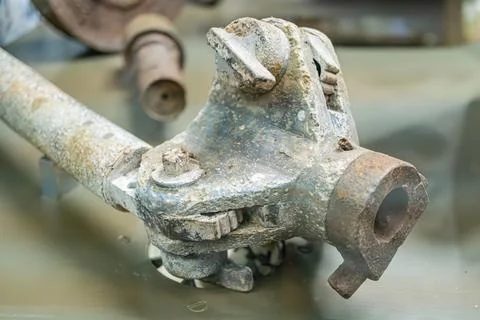 Rusted metallic object, possibly machinery part Indoor setting with other m.. Stock Photos