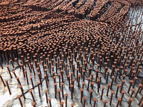 Rusted Nails Inserted On Canvas Board Stock Photos