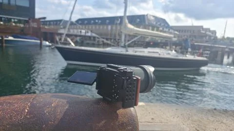 Rusted pier holds a compact camera lens Stock-Fotos