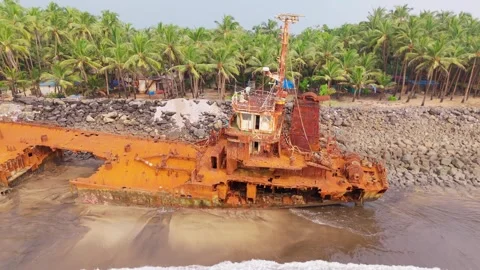 Rusted Scrap Ship Stranded on Tropical Shore Stock Footage 295924857