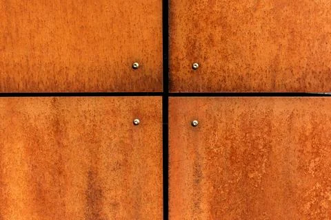 Rusted steel plates cladding texture, orange rust metal background with joints Stock-Fotos