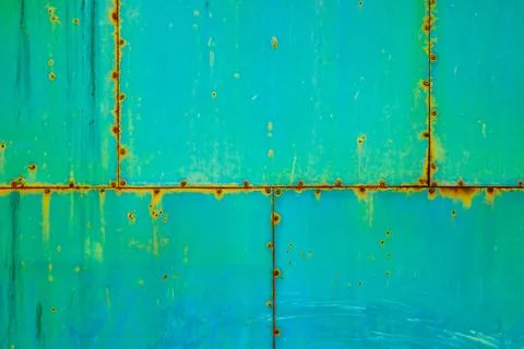 Rusted Teal Metal Surface with Rivets Stock Photos