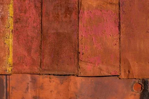 Rusted tin sheets patchwork wall texture and flat background Stockfoto's