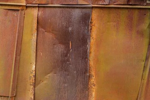 Rusted tin sheets patchwork wall texture and flat background Stock Photos