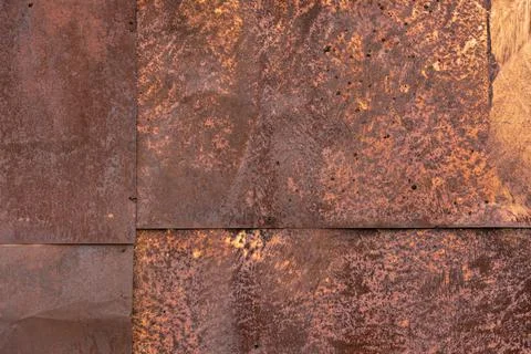 Rusted tin sheets patchwork wall texture and flat full frame background 库存照片