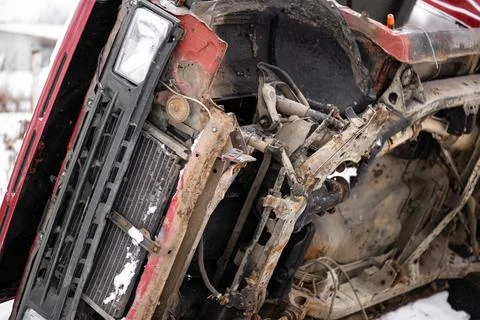 Rusted torched broken-down red car winter day snowflakes Stock Photos