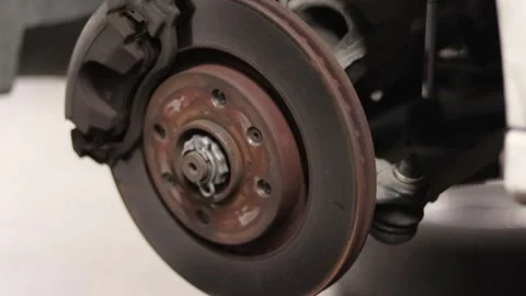 Rusted wheel disk footage, vehicle maintenance close Stock Footage