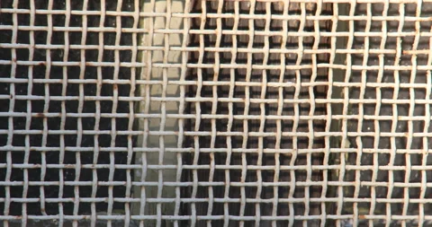 Rusted woven metallic grate Vídeos de archivo 144110486