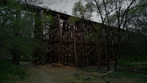 Rustic abandoned railroad bridge in a forest Stock Photos