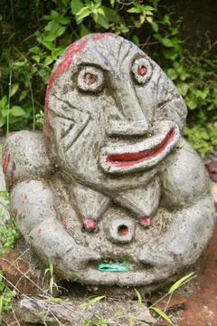 Rustic Abstract Painted Stone Sculpture Figure in Garden Ubud, Bali Stock Photos