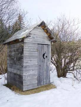 Rustic Alaskan outhouse Stock Photos