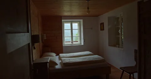 Rustic alpine bedroom with mountain view in Val di Funes Stock Footage 340778428
