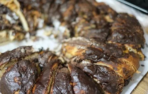 A rustic and appetizing close-up of a freshly baked chocolate babka, or a sim Stock Photos