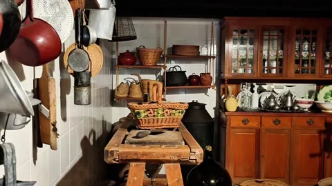 A Rustic and Cozy Kitchen Interior Featuring Vintage Kitchenware and Decor Stock Footage 317058774
