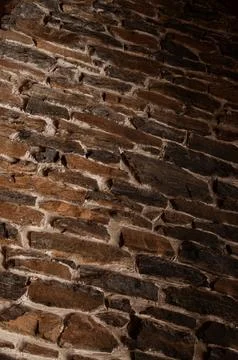 A rustic and textured stone wall with natural rock and mortar Stock Photos