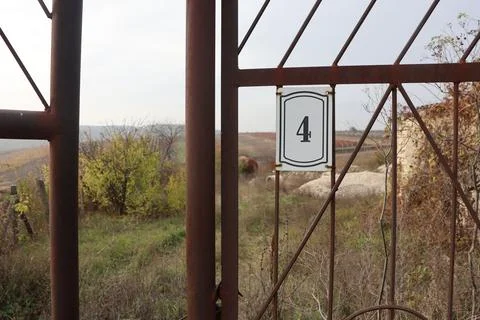 A Rustic and Weathered Gate Number Four Set Against a Beautiful and Scenic Stock Photos
