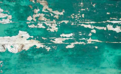 Rustic and weathered turquoise colored paint on wood panel Stock Photos
