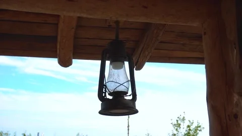 Rustic Antique Oil Lantern Hanging Under Wooden Porch Roof 動画素材 342207834
