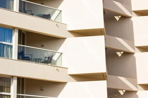 Rustic apartment building poor architecture exterior concrete wall facade wit Stock Photos