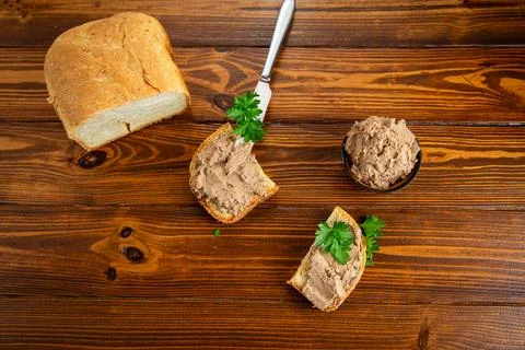 Rustic appetizer with liver pate and parsley garnish Stock Photos