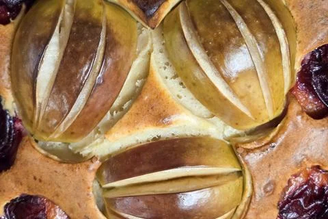 Rustic Apple and Plum Cake Close-Up for Autumn Baking and Desserts Stock Photos