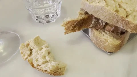 Rustic Artisan Bread and Water Glass on White Table Close Up Stock Footage 340187895