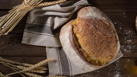 Rustic Artisan Bread Loaf on a Wooden Table Stock Photos