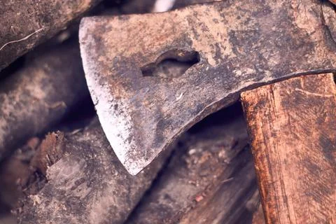 Rustic axe on pile of wood Stock Photos