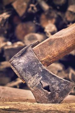 Rustic axe on pile of wood Stock Photos