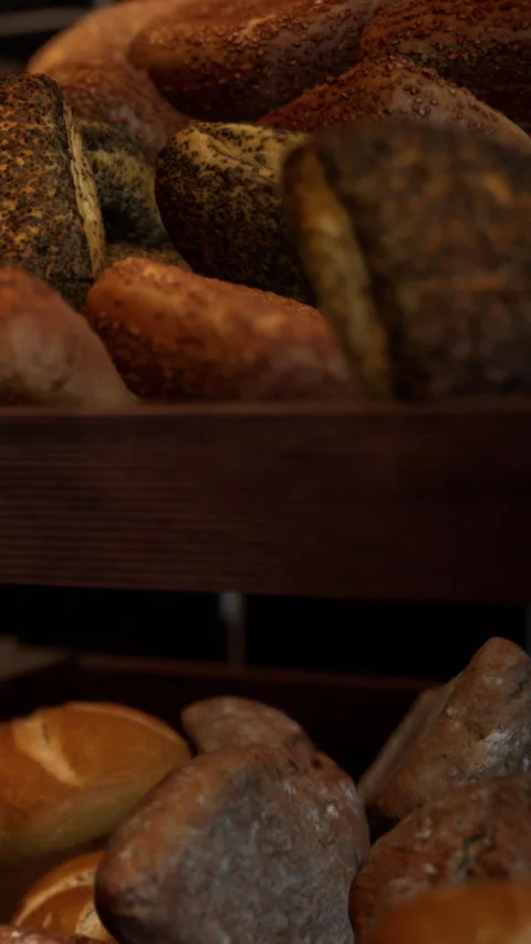 Rustic baked bread displayed on wooden tray in local bakery setting Stock Footage 342179418