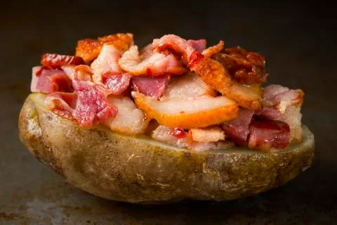 Rustic baked jacket potato with bacon Stock Photos