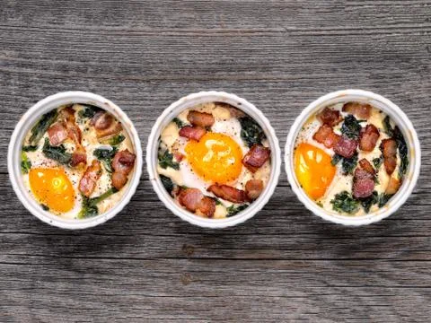 Rustic baked potted egg Stock Photos