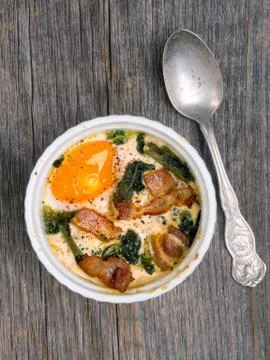 Rustic baked potted egg Stock Photos