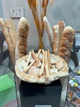 Rustic Bakery Display with Artisan Loaves and Fresh Breadsticks Stock Photos