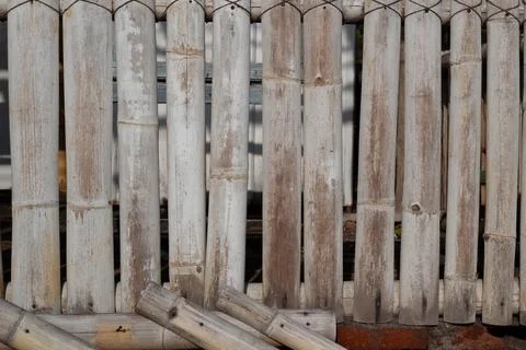 Rustic Bamboo Fence with Weathered Texture in Natural Light, a charming rusti Stock Photos