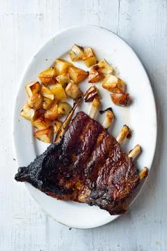 Rustic barbequed pork ribs Stock Photos