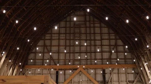 Rustic barn interior with hanging lights Stock Footage 338035216