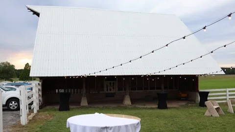 Rustic barn venue with string lights Stock Footage 338034880
