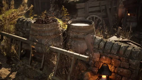 Rustic barrels beside stone wall in an outdoor setting at twilight Stock Footage 331420643