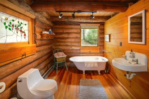 A rustic bathroom in a log home Stock Photos