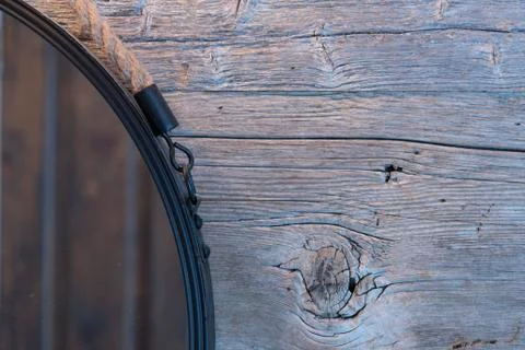 Rustic bathroom mirror on weathered wood background Stock Photos