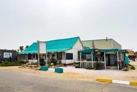 Rustic beachfront bed and breakfast accommodations in small coastal town Stock Photos