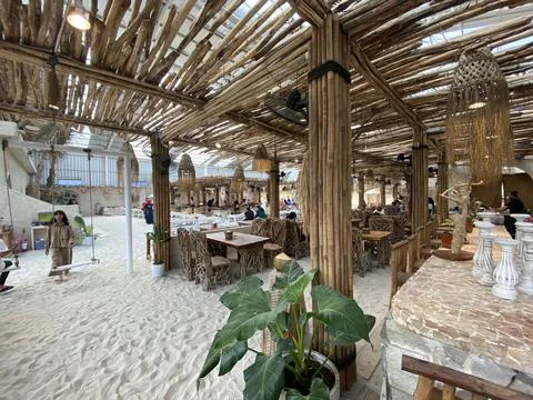 Rustic beachside restaurant with bamboo decor Stock Photos