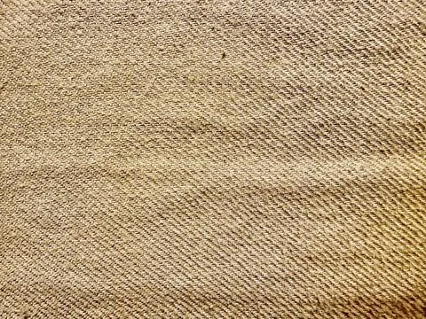 Rustic beige burlap texture closeup with diagonal weave pattern evoking natur Stock Photos