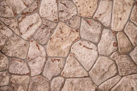 Rustic beige stone wall texture with irregular flagstone patterns for archi.. Foto stock
